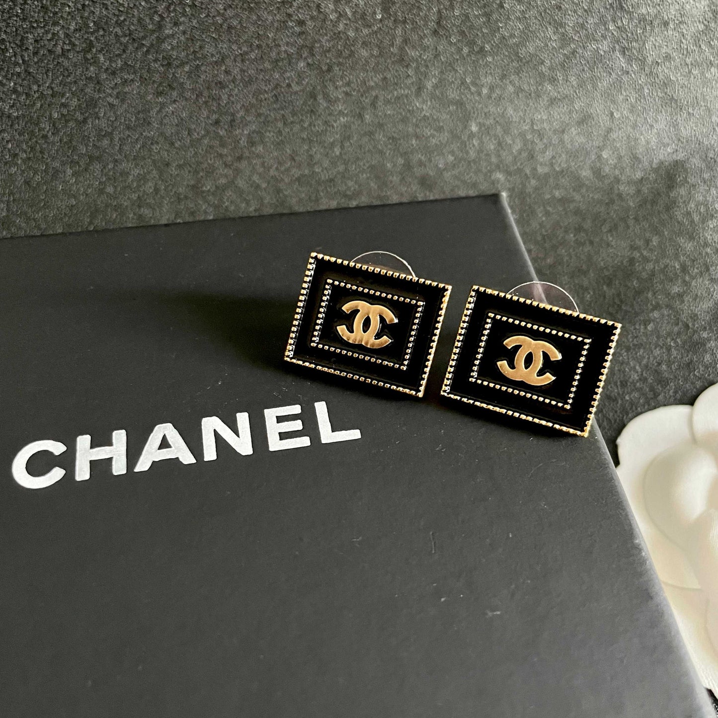 Double-C Emblem Stud Earrings in Polished Metal-Tone – Design 168 detail view