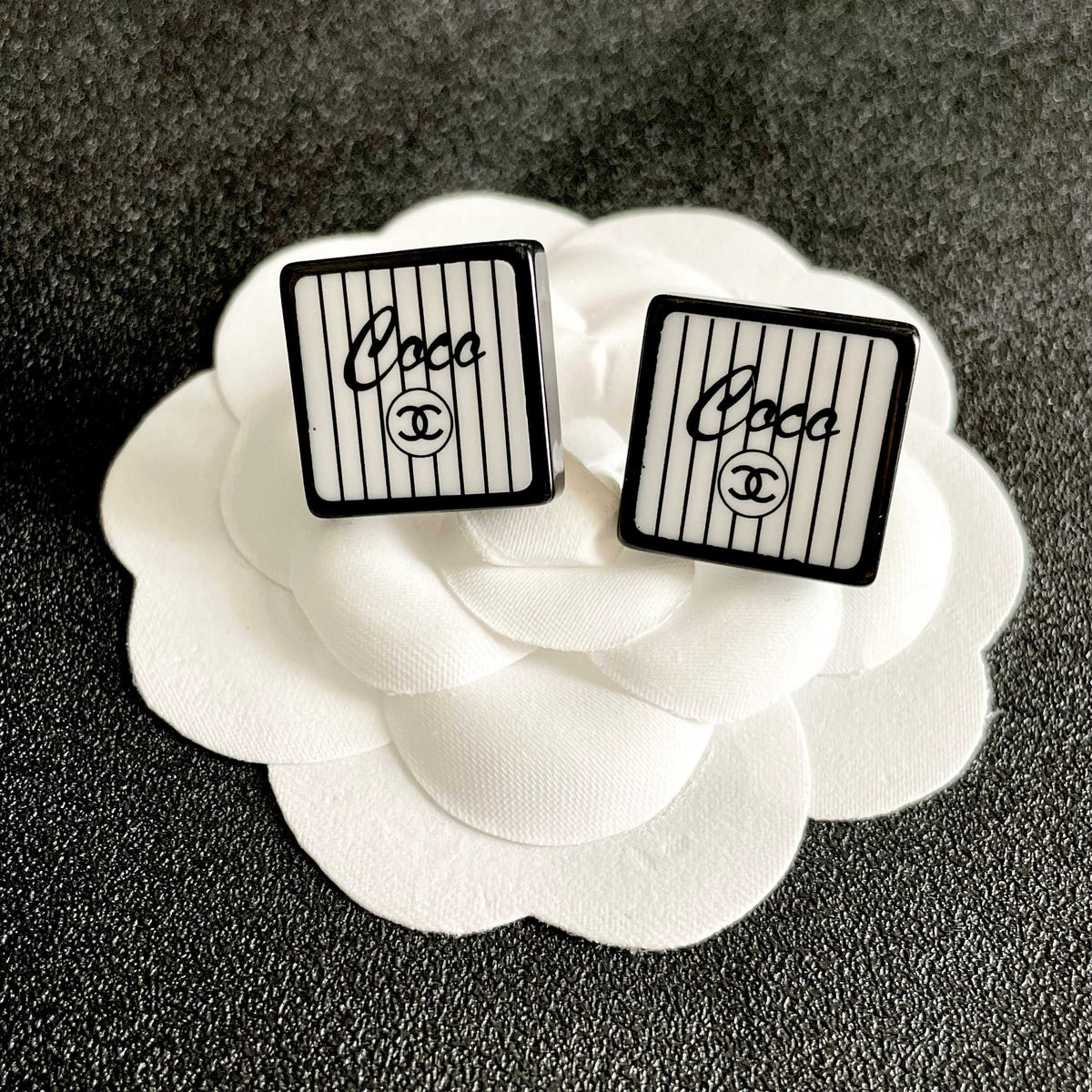Double-C Emblem Stud Earrings in Polished Metal-Tone – Design 177 front product view