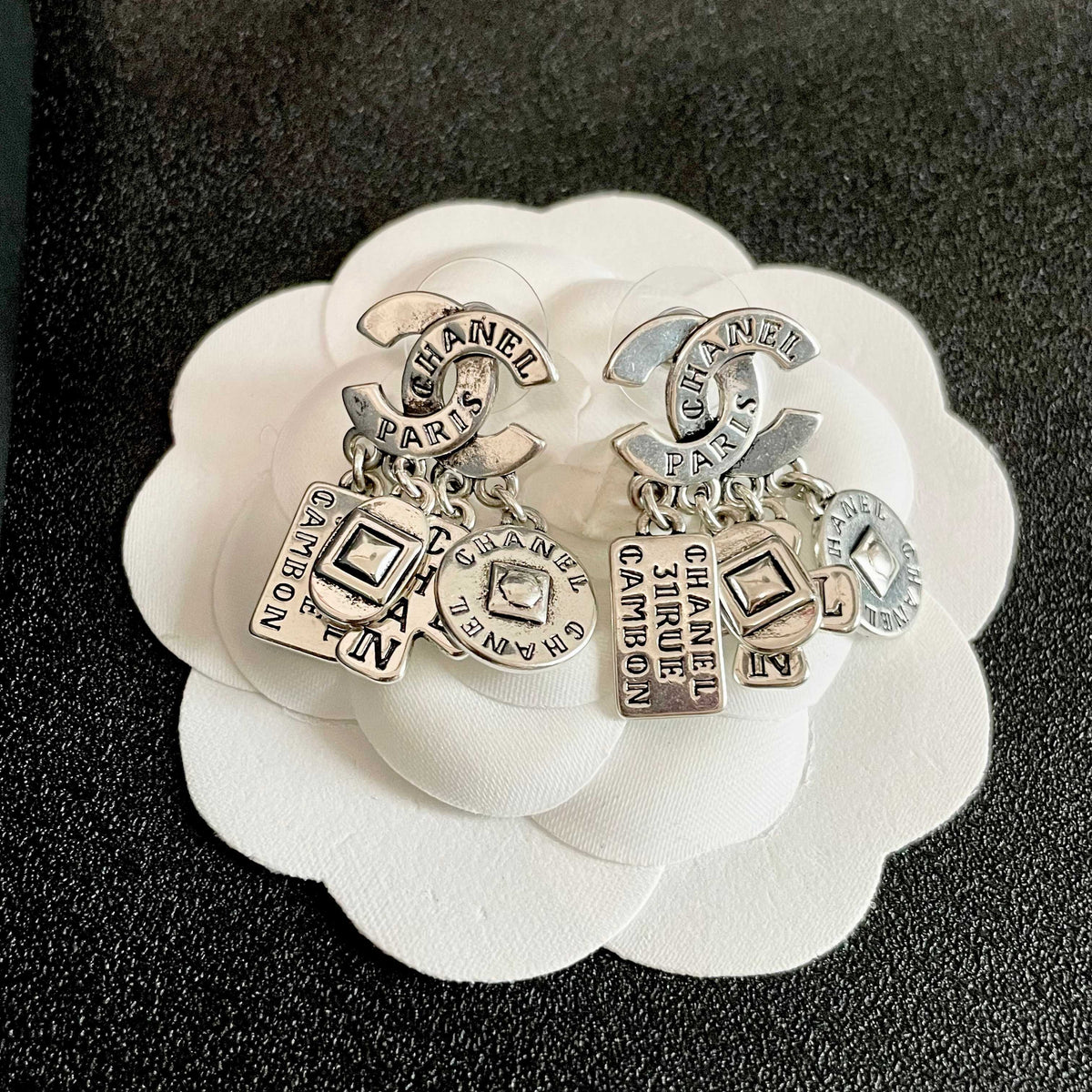 Double-C Emblem Stud Earrings in Polished Metal-Tone – Design 449 front product view
