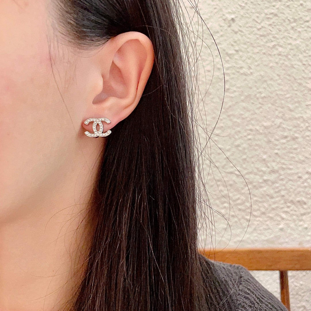 Double-C Emblem Stud Earrings in Polished Metal-Tone – Design 441 detail view