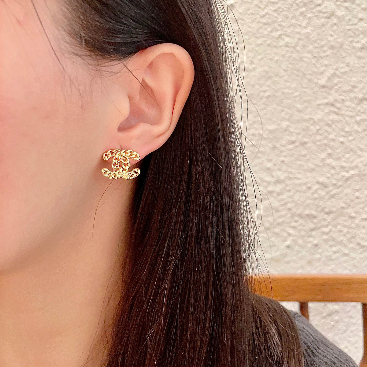 Double-C Emblem Stud Earrings in Polished Metal-Tone – Design 440 detail view