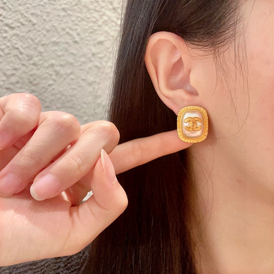 Double-C Emblem Stud Earrings in Polished Metal-Tone – Design 472 front product view