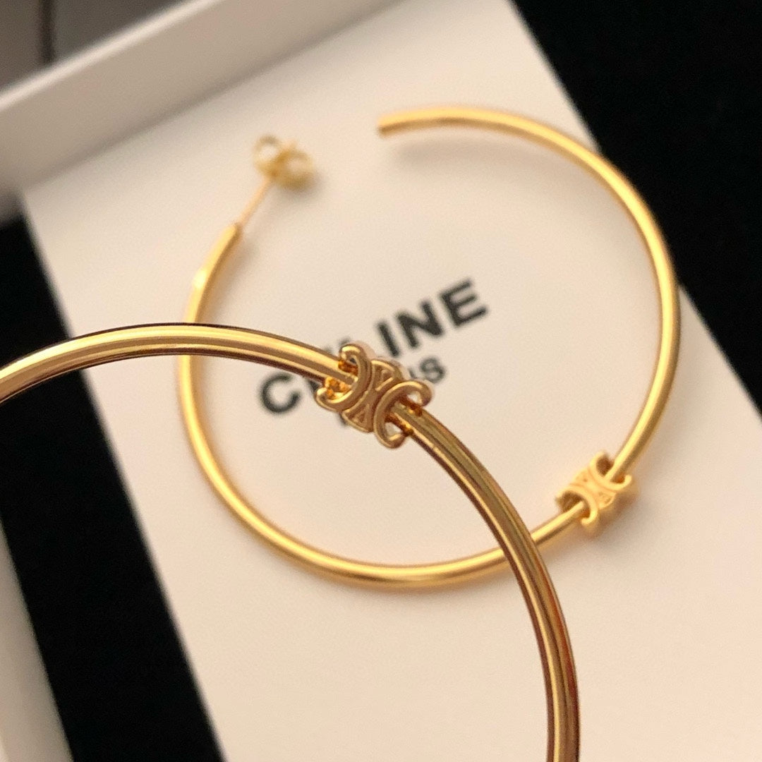 Oversized Triomphe-Inspired Emblem Statement Earrings styled detail