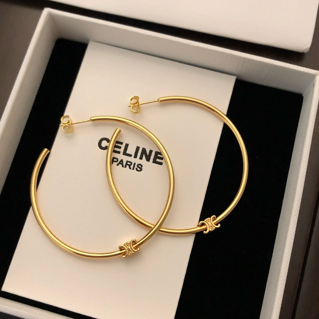 Oversized Triomphe-Inspired Emblem Statement Earrings close-up view