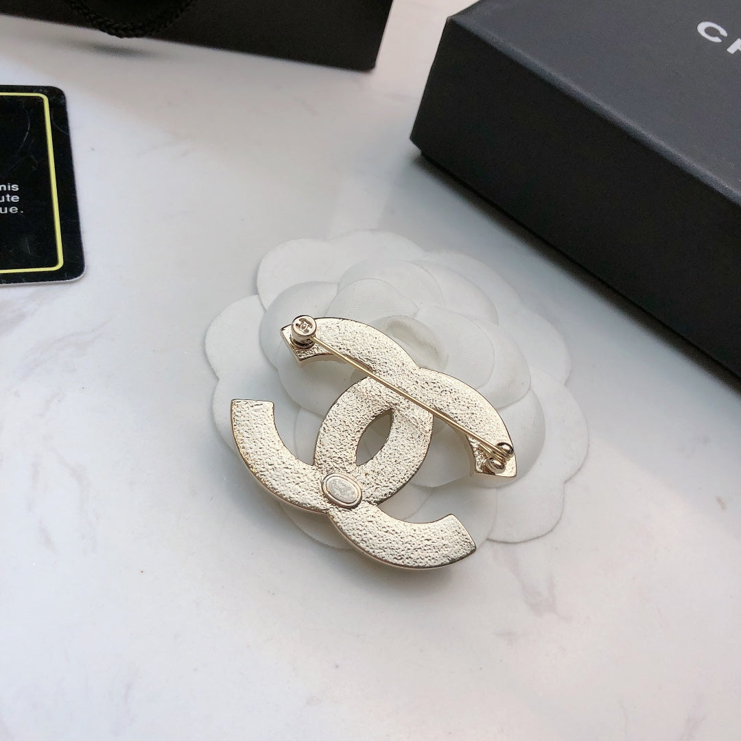 Signature Emblem Brooch in Polished Metal-Tone – Design 034 front product view