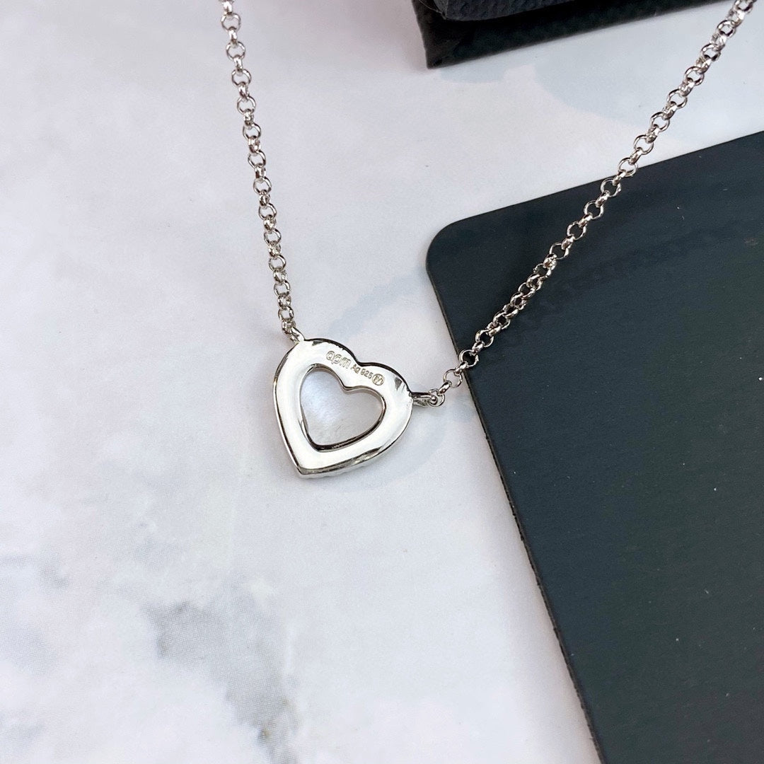 Adjustable Heart Pendant Necklace in Polished Metal-Tone close-up detail
