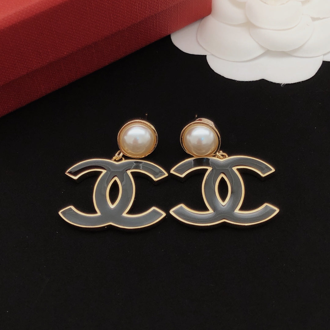 Signature Emblem Stud Earrings in Gold-Tone – Black Detail – Design 002 detail view