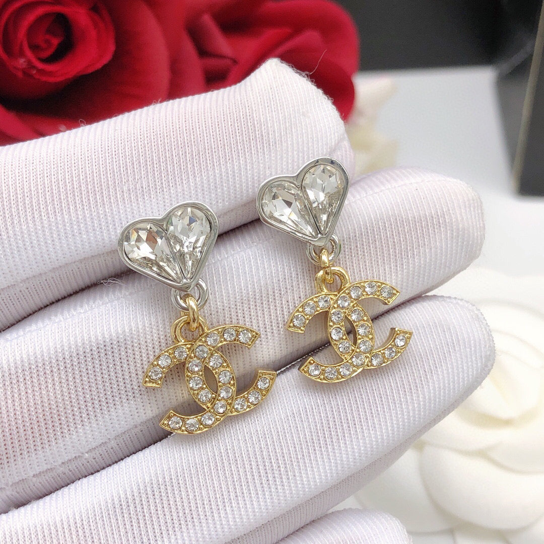 Double-C Emblem Jewelry Accessory in Gold-Tone – Heart Detail detail view