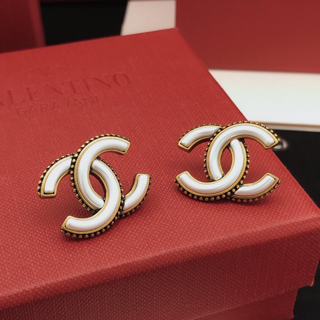 Double-C Emblem Stud Earrings in Gold-Tone – White Detail front product view