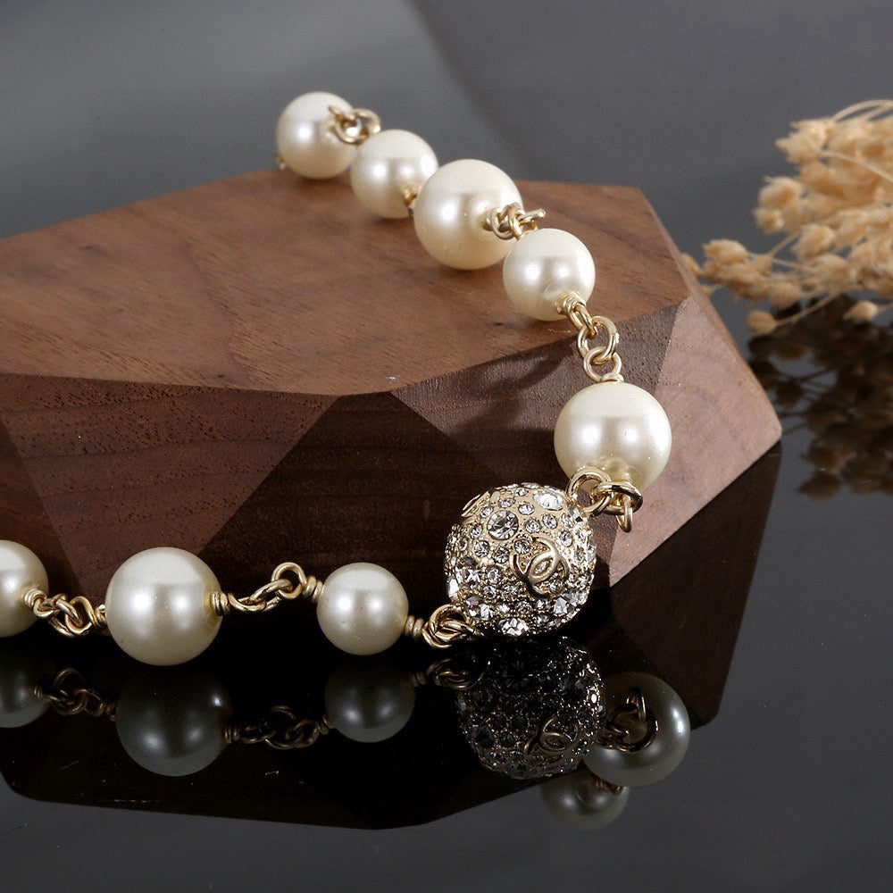 Double-C Emblem Pearl-Detail Pendant Necklace – Pearl Detail – Design 058 styled product view