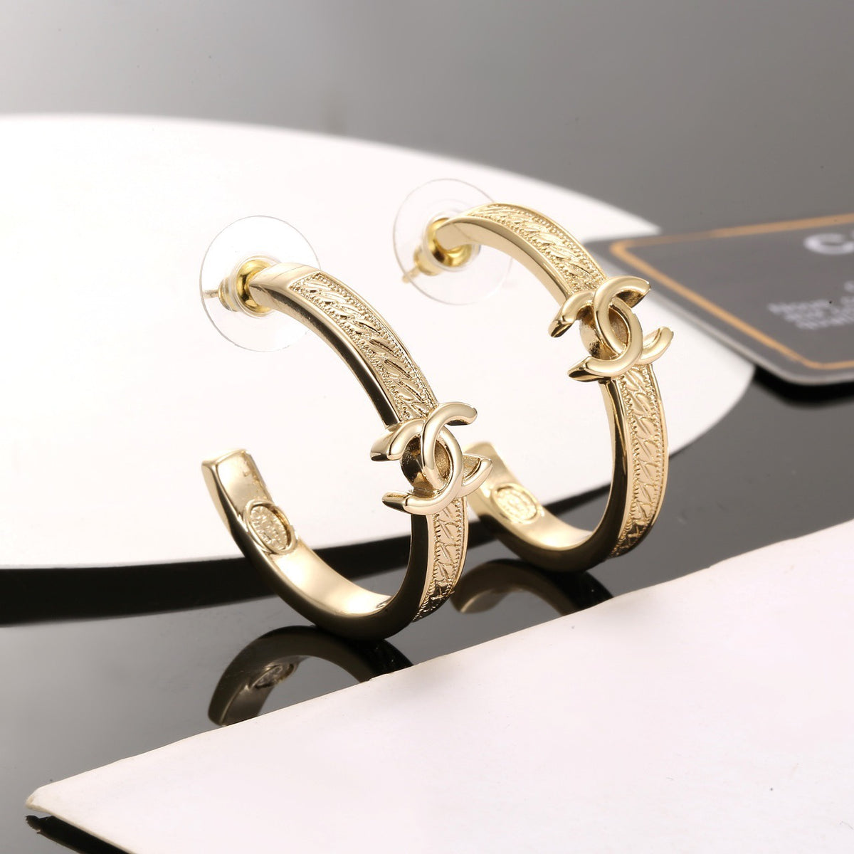 Signature Emblem Stud Earrings in Polished Metal-Tone – Design 018 side detail