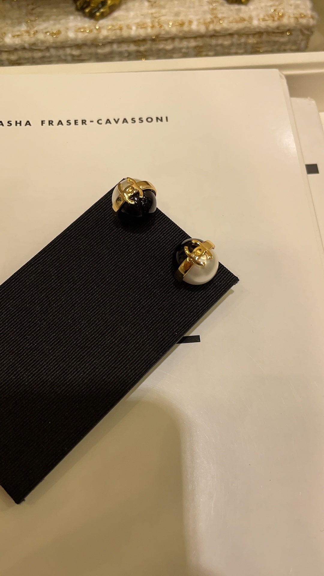 Double-C Emblem Stud Earrings in Polished Metal-Tone – Black Detail – Design 002 close-up detail