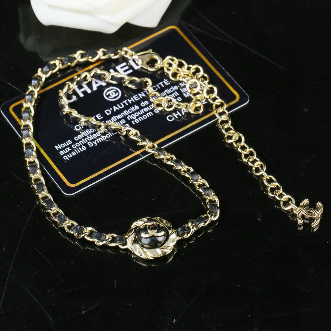 Double-C Emblem Pendant Necklace in Gold-Tone – Black Detail close-up detail