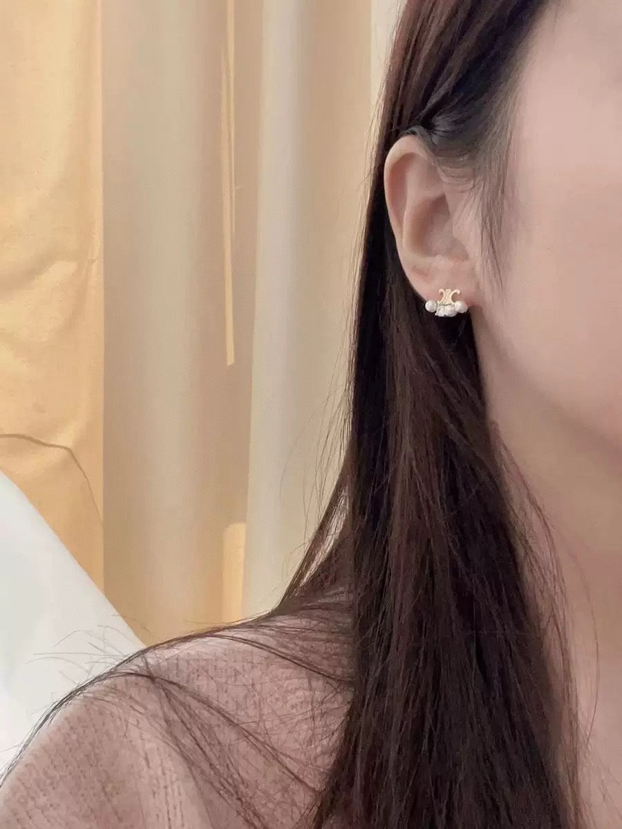 Mini Mini Stud Earrings styled detail