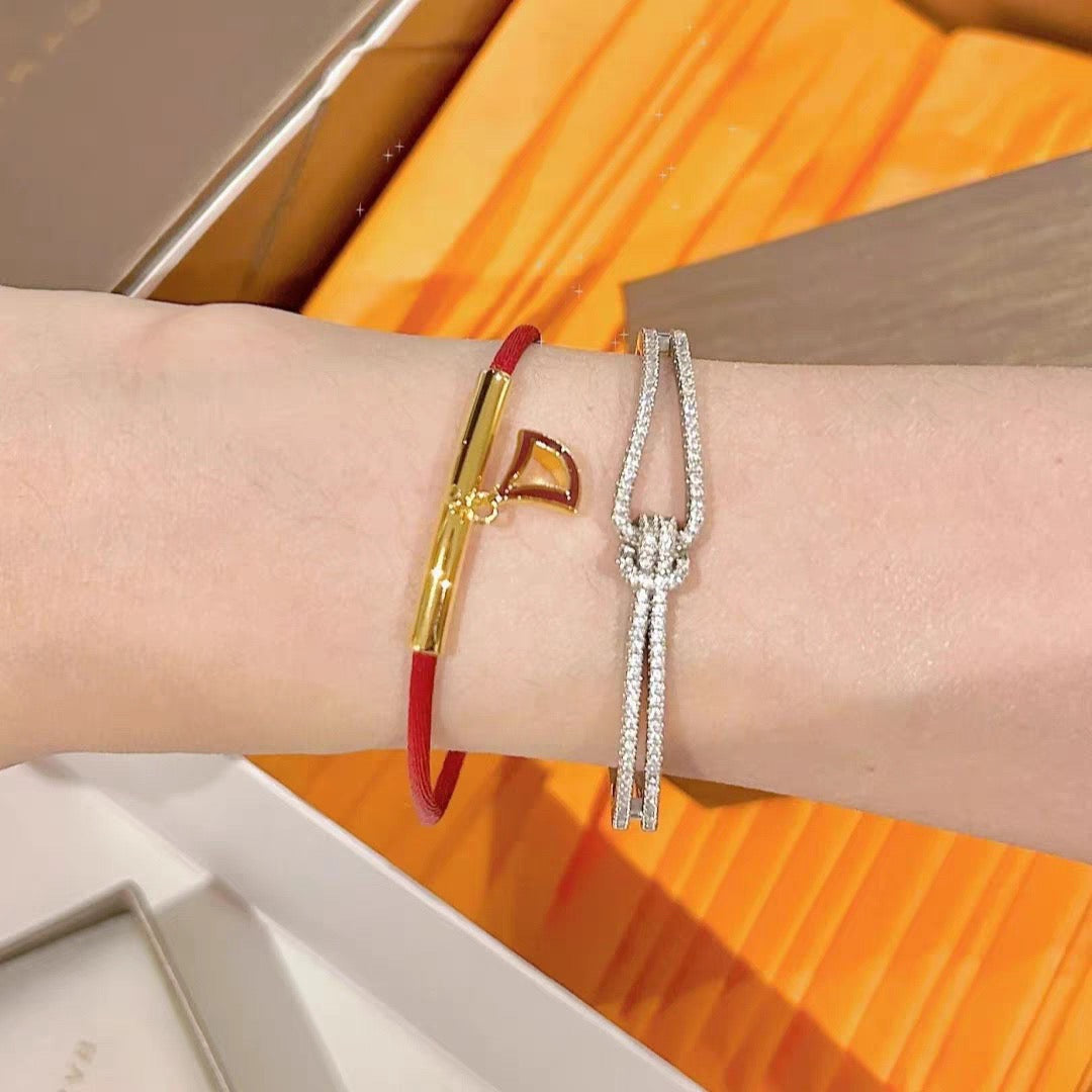 Red Cord Braided Bracelet in Polished Metal-Tone – Red Cord Detail close-up detail