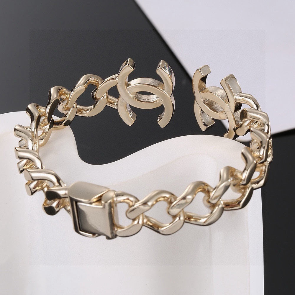 Signature Emblem Bangle in Polished Metal-Tone – Design 016 detail view
