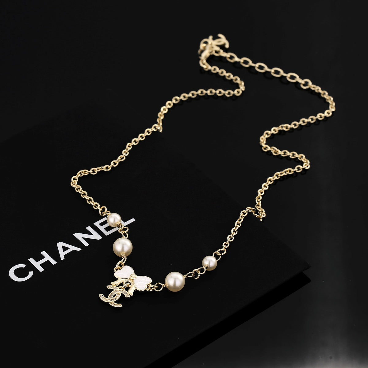 Bow Pendant Necklace in Polished Metal-Tone main product view