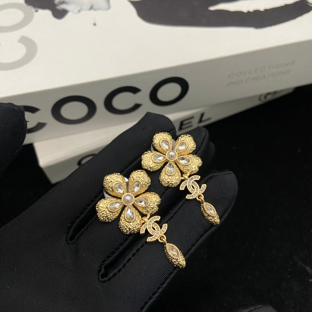 Double-C Emblem Stud Earrings in Polished Metal-Tone – Design 247 close-up detail