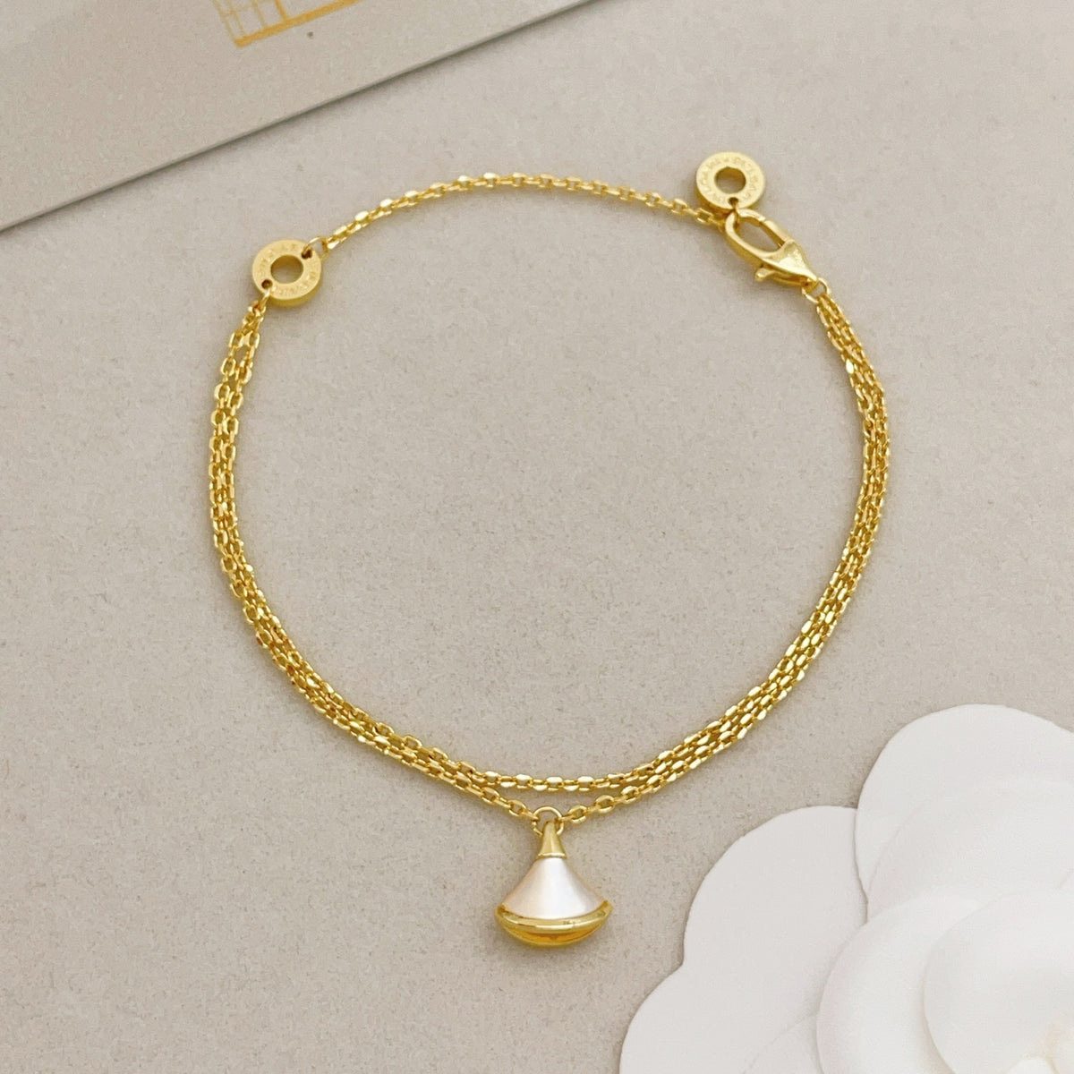 Geometric Emblem Bracelet in Gold-Tone detail view