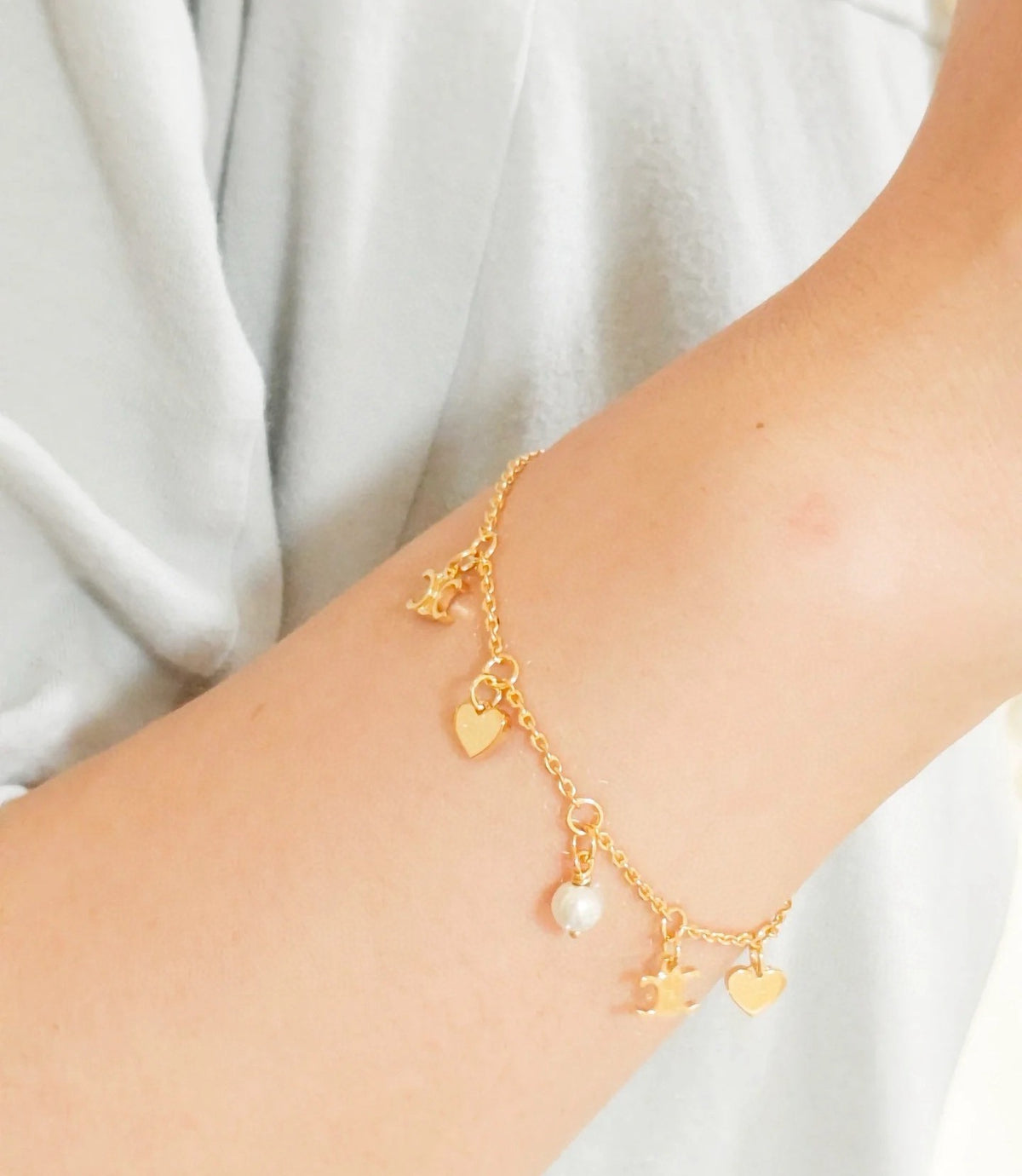 Signature Emblem Bracelet in Polished Metal-Tone – Red Detail – Design 002 front product view