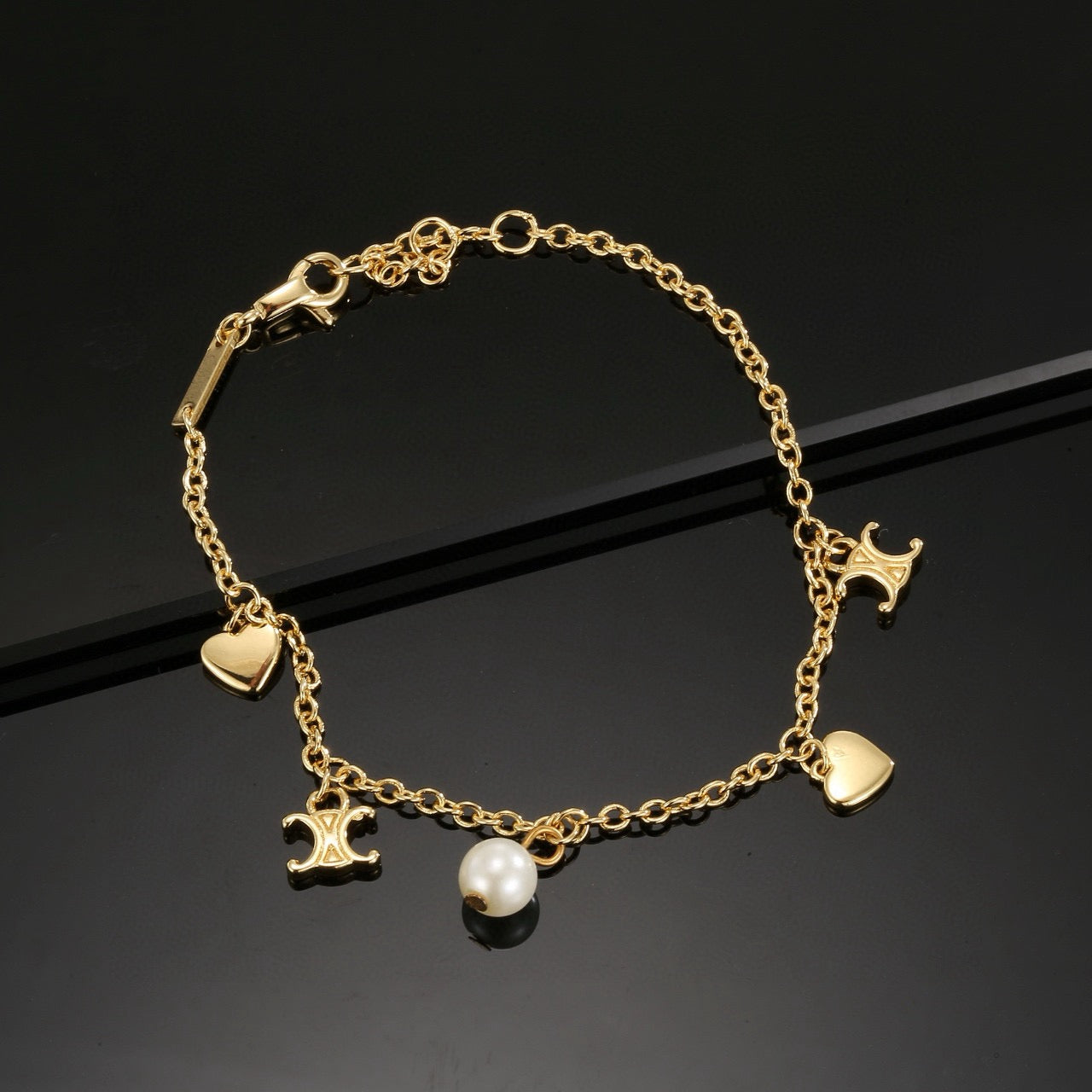 Triomphe-Inspired Emblem Bracelet in Gold-Tone – Red main product view