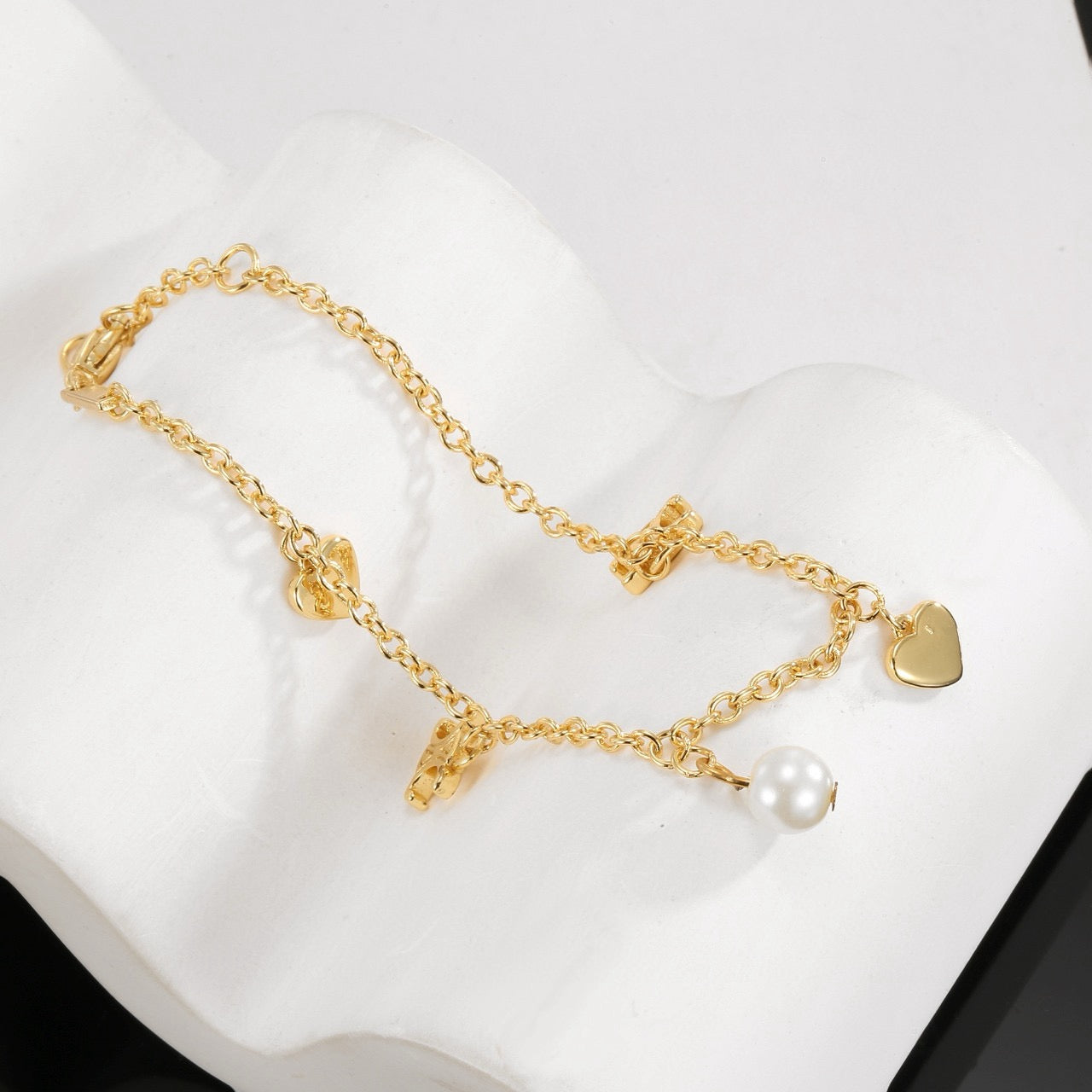 Triomphe-Inspired Emblem Bracelet in Gold-Tone – Red front view