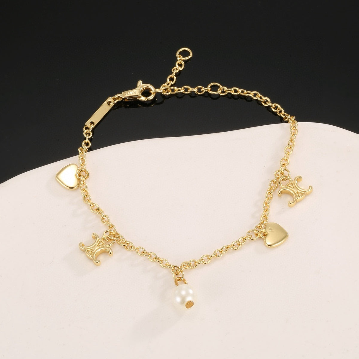 Triomphe-Inspired Emblem Bracelet in Gold-Tone – Red – Design 02 styled detail