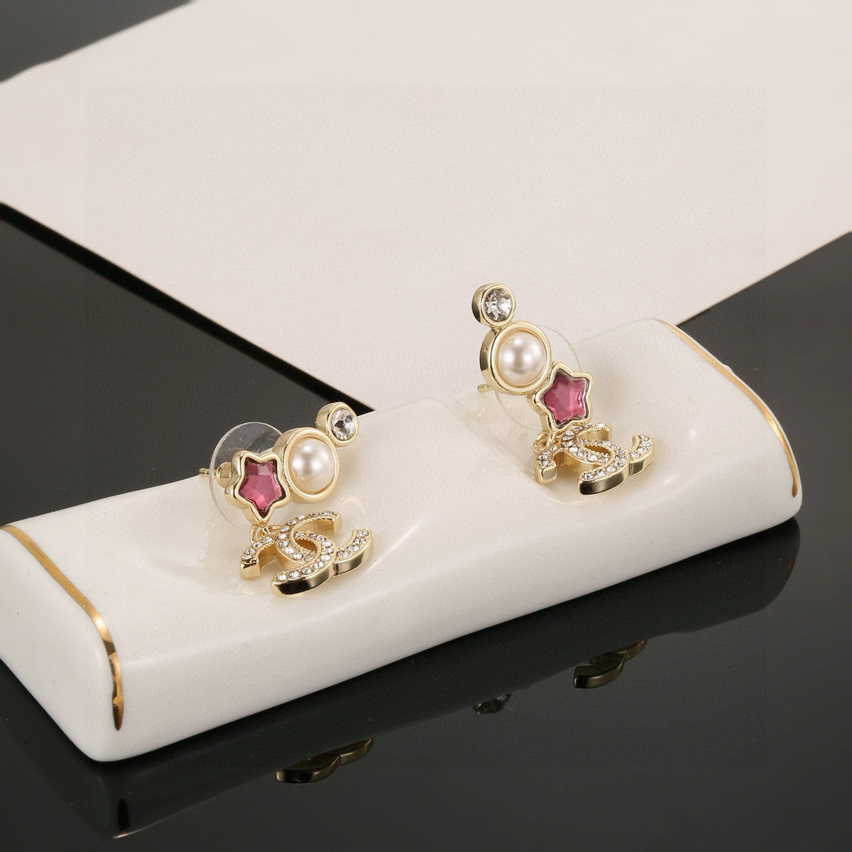 Double-C Emblem Stud Earrings in Gold-Tone – Star Detail – Design 006 side detail
