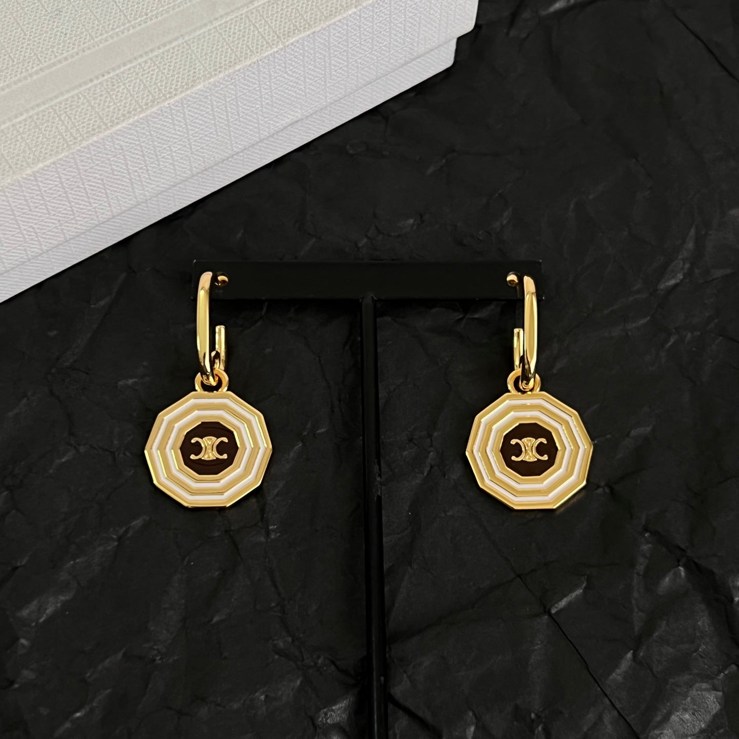 Signature Emblem Stud Earrings in Polished Metal-Tone – Design 03 close-up view