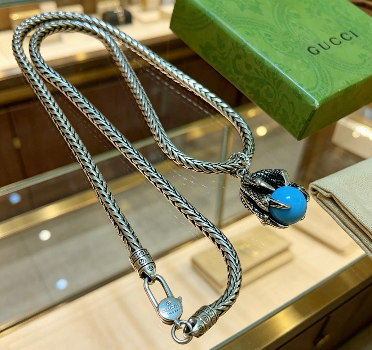 Double-G Emblem Pendant Necklace in Polished Metal-Tone – Turquoise Detail detail view