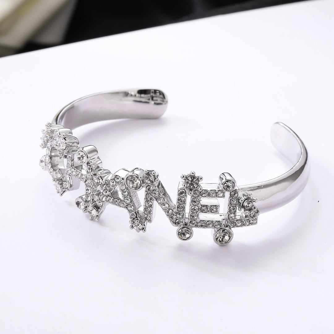 Signature Emblem Bangle in Polished Metal-Tone – Design 030 close-up detail