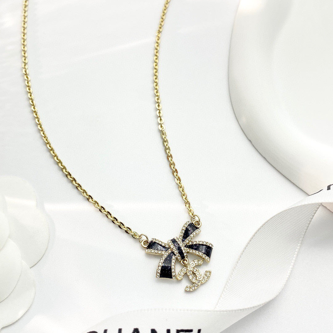 Bow Pendant Necklace in Black-Tone detail view