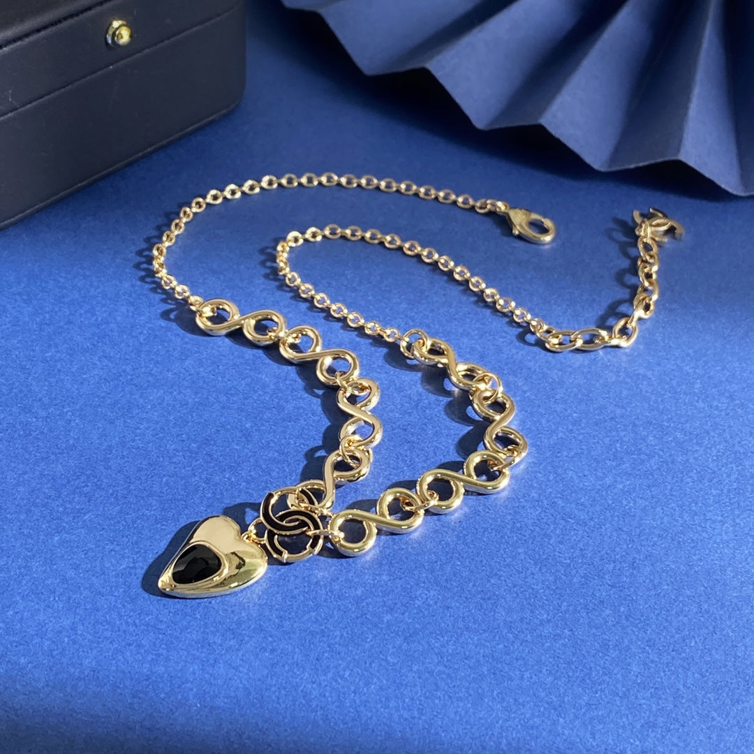 Double-C Emblem Pendant Necklace in Gold-Tone – Heart Detail – Design 002 close-up detail