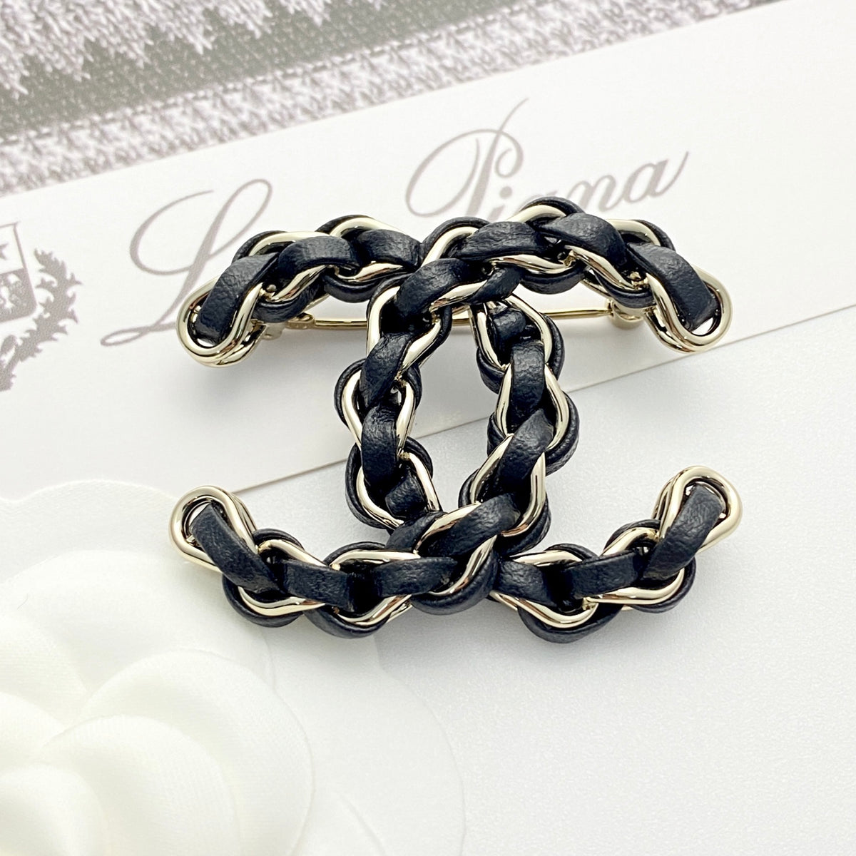 Signature Emblem Brooch in Polished Metal-Tone – Black Detail – Design 003 front product view