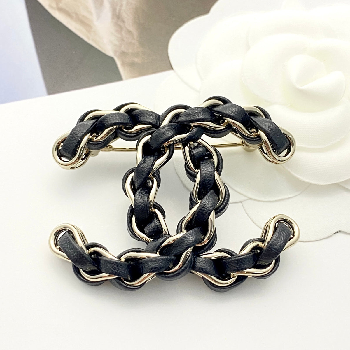 Signature Emblem Brooch in Polished Metal-Tone – Black Detail – Design 003 detail view