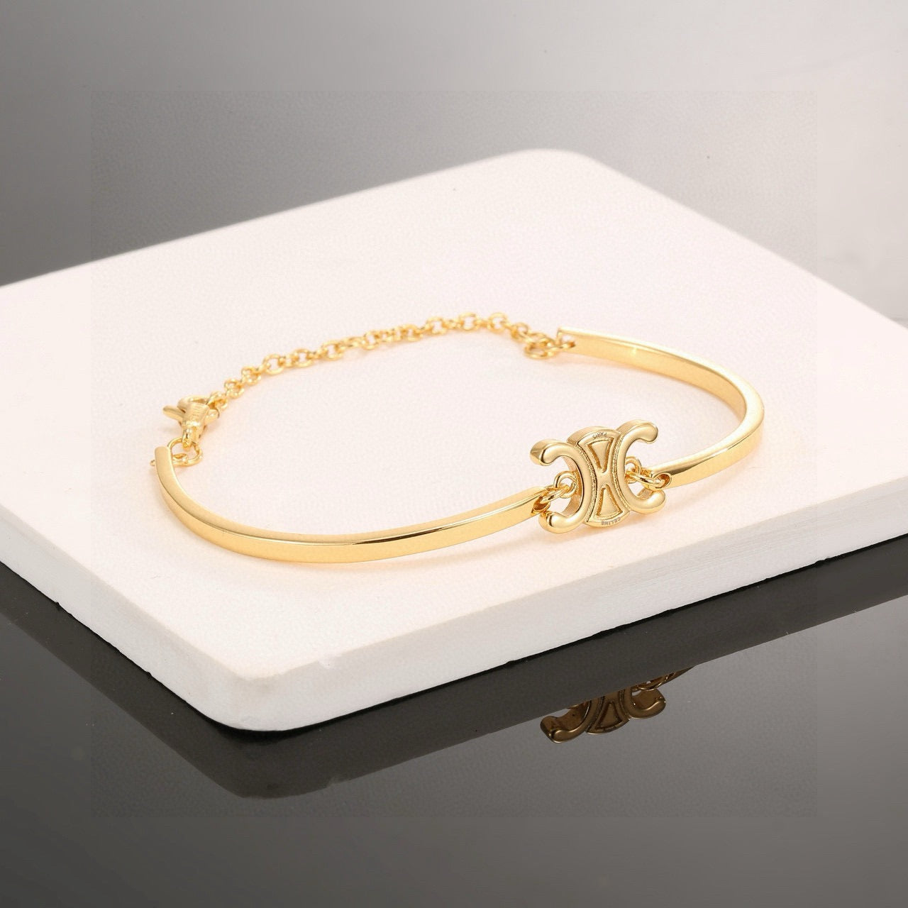 Triomphe-Inspired Emblem Cuff Bracelet in Gold-Tone side detail