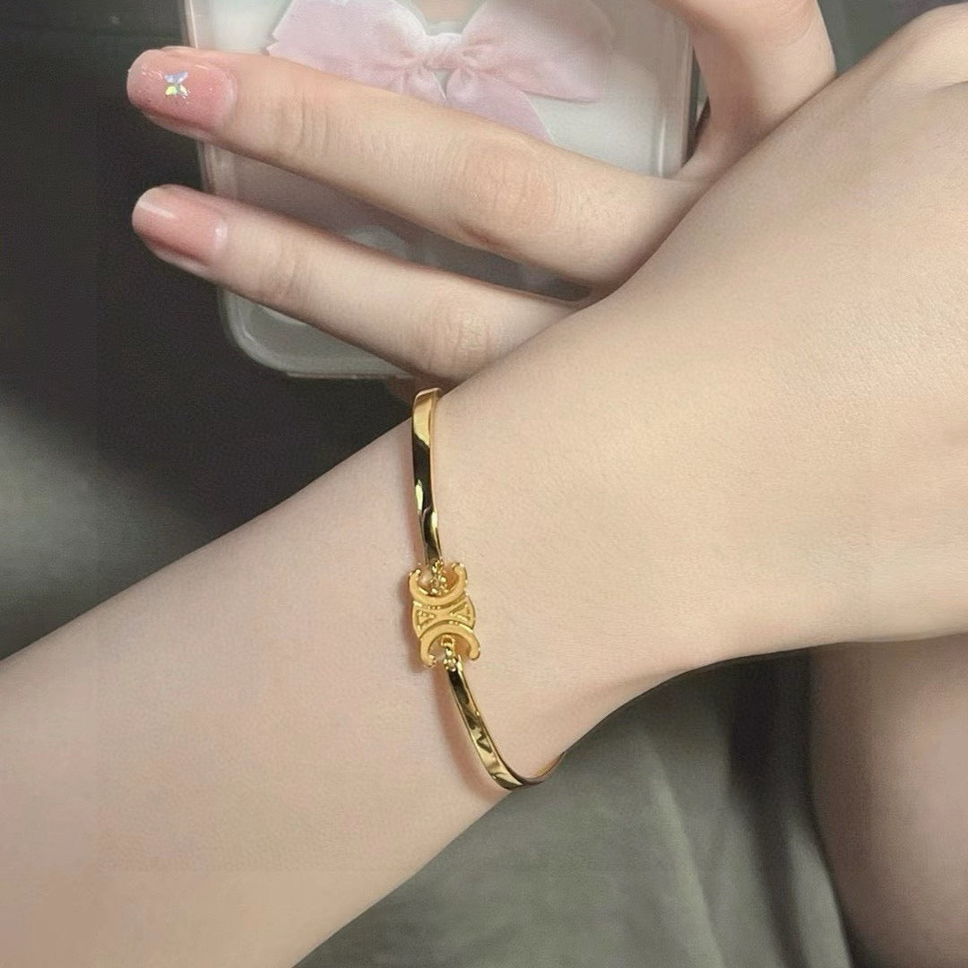 Triomphe-Inspired Emblem Cuff Bracelet in Gold-Tone detail view
