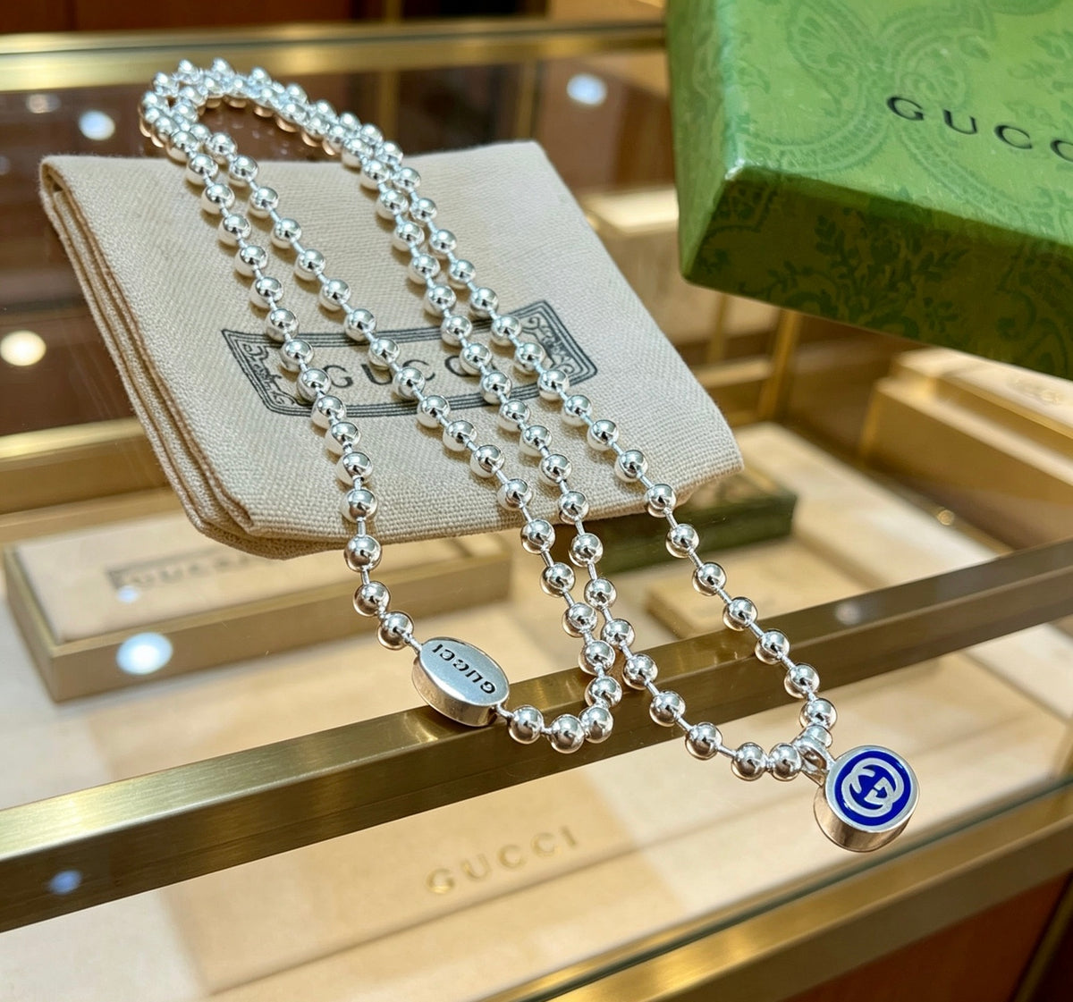 Double-G Emblem Pendant Necklace in Silver-Tone – Design 050 close-up detail