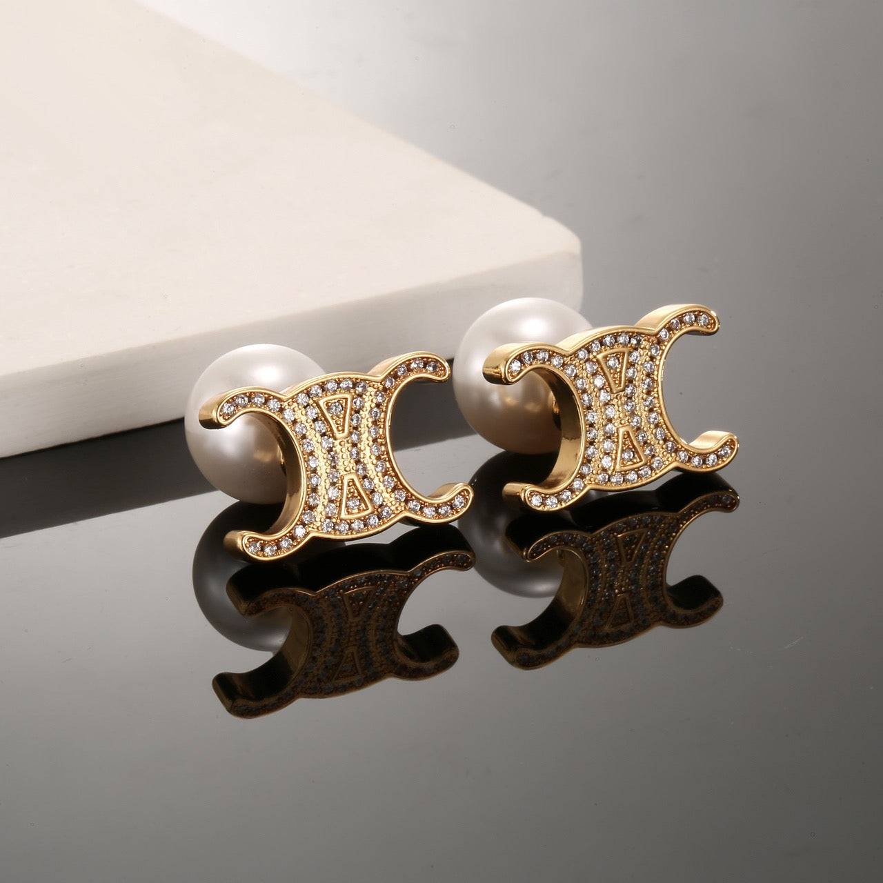 Signature Emblem Stud Earrings in Gold-Tone – Design 09 styled detail