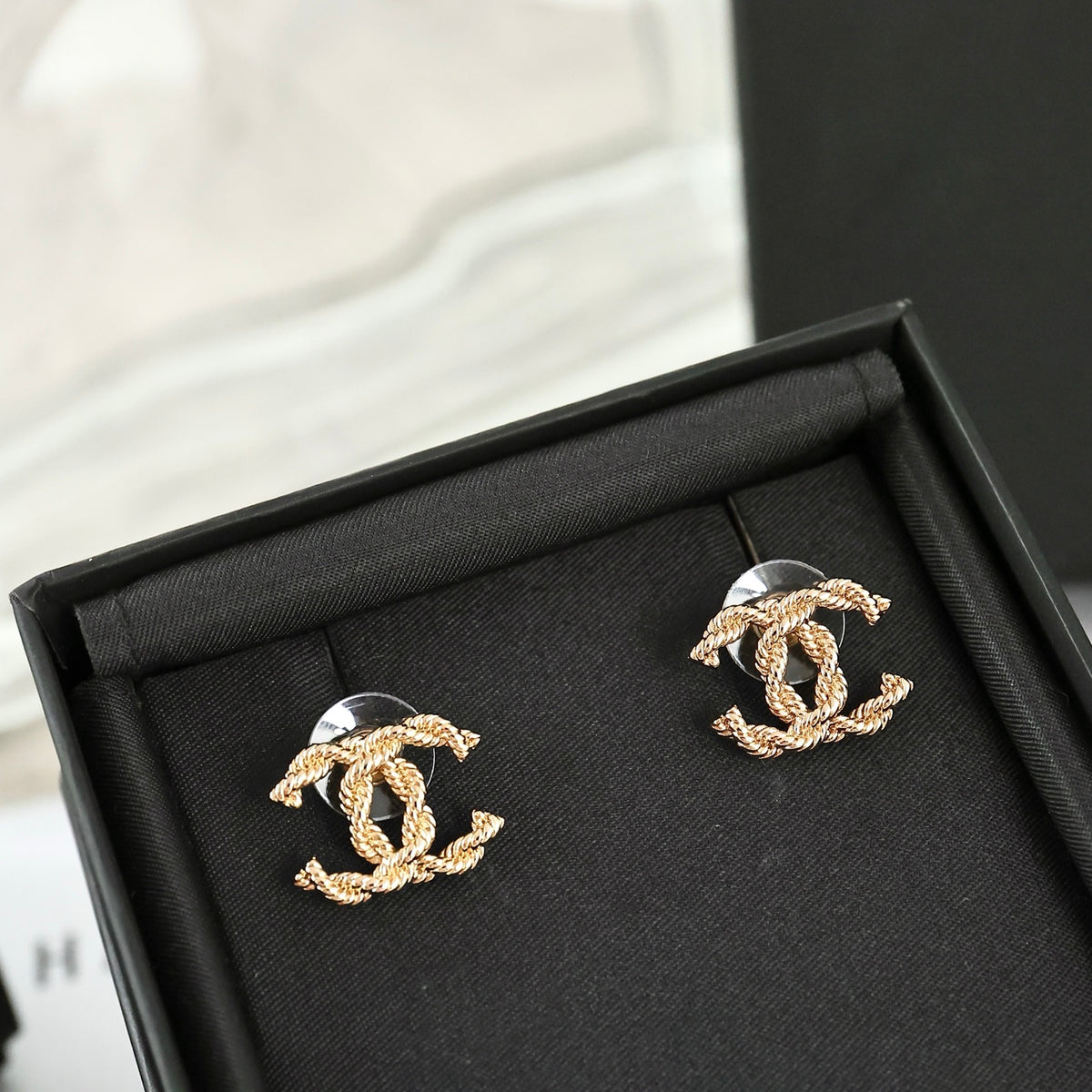 Double-C Emblem Stud Earrings in Polished Metal-Tone – Design 325 close-up detail