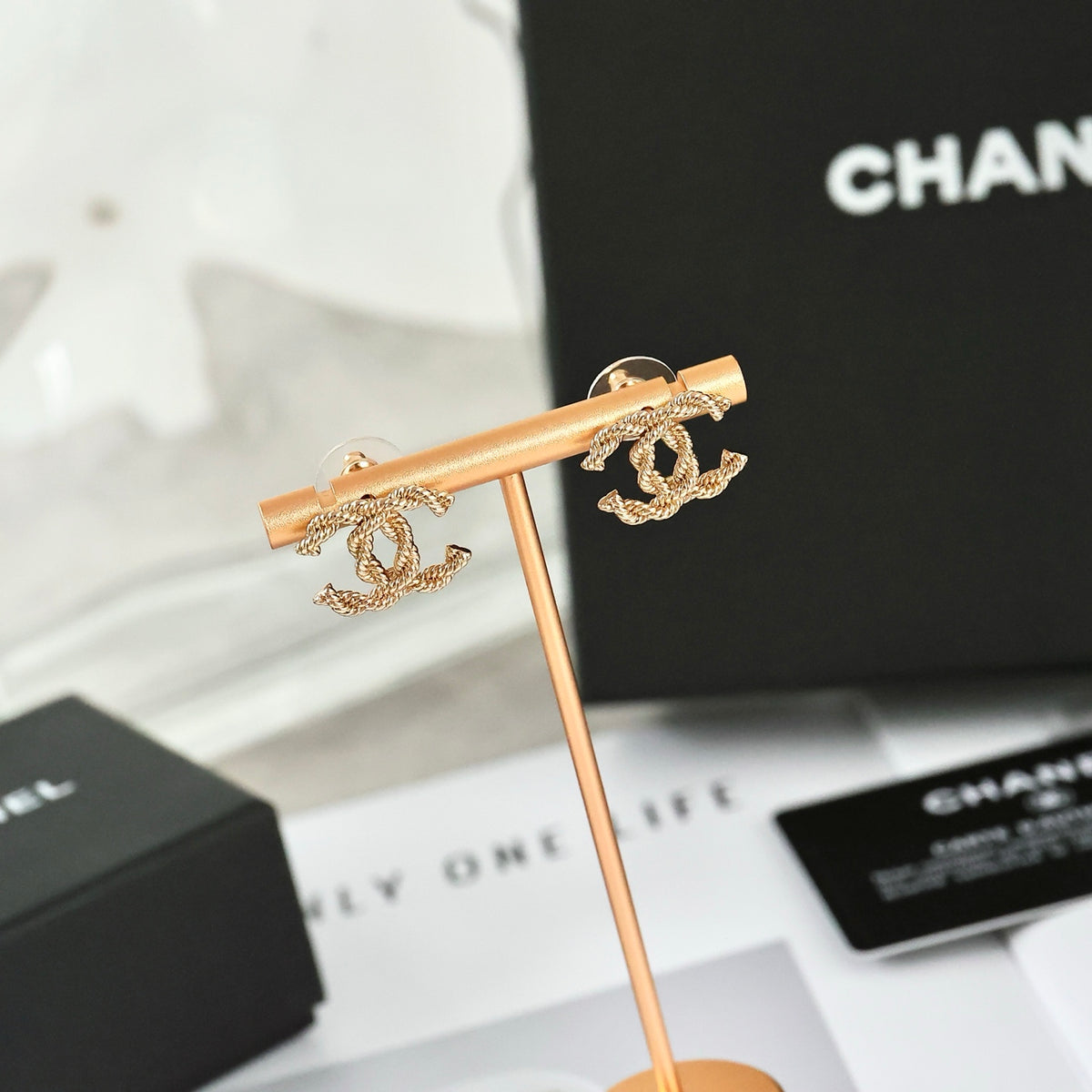 Double-C Emblem Stud Earrings in Polished Metal-Tone – Design 325 front product view