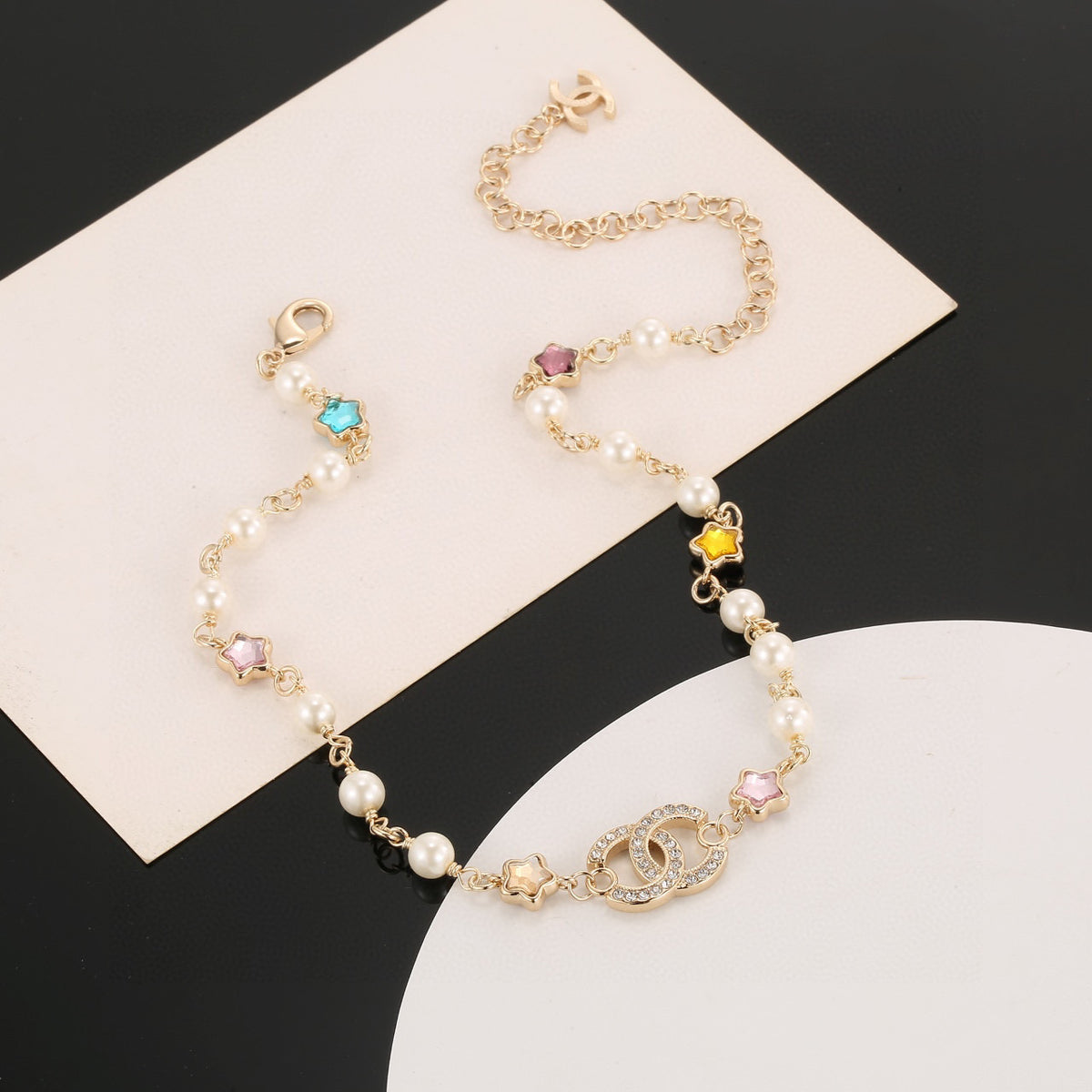 Double-C Emblem Pearl-Detail Pendant Necklace – Pearl Detail – Design 103 styled product view