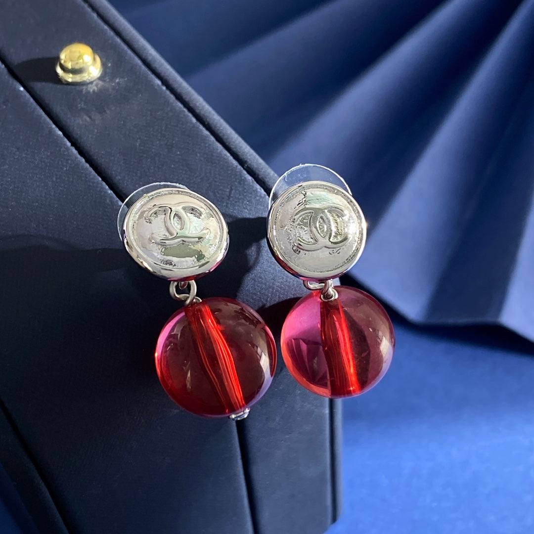 Double-C Emblem Stud Earrings in Silver-Tone – Red Detail close-up detail