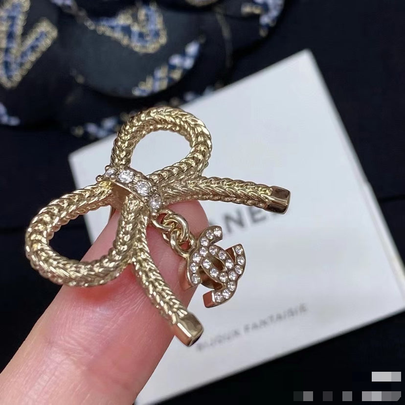 Double-C Emblem Stud Earrings in Polished Metal-Tone – Design 382 styled product view