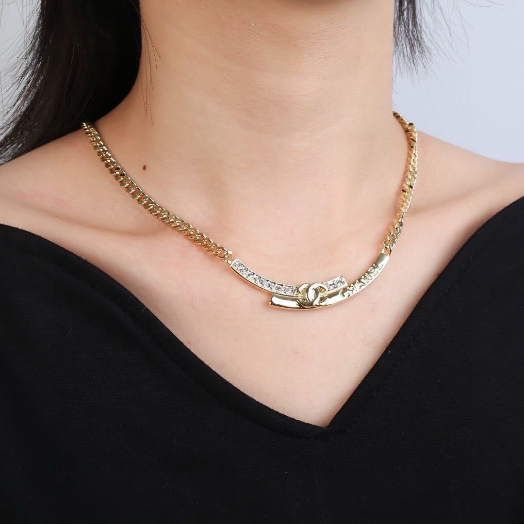 Double-C Emblem Pendant Necklace in Polished Metal-Tone – White Detail front product view