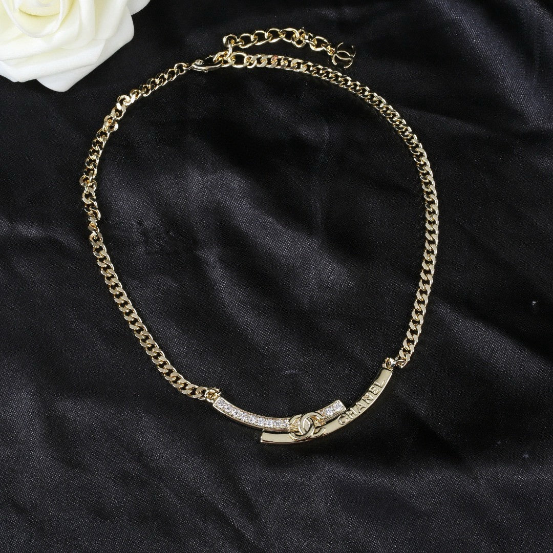 Double-C Emblem Pendant Necklace in Polished Metal-Tone – White Detail main product view