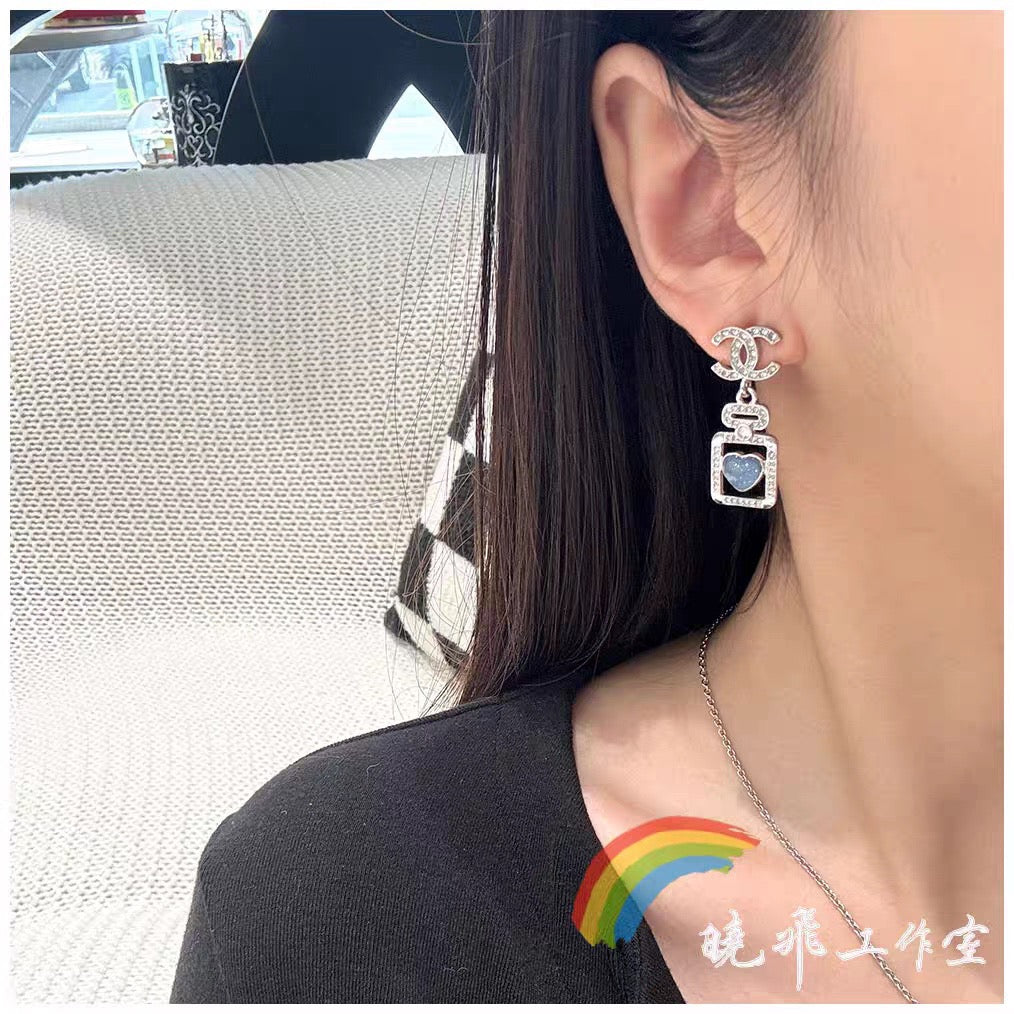 Signature Emblem Stud Earrings in Polished Metal-Tone – Design 112 front product view