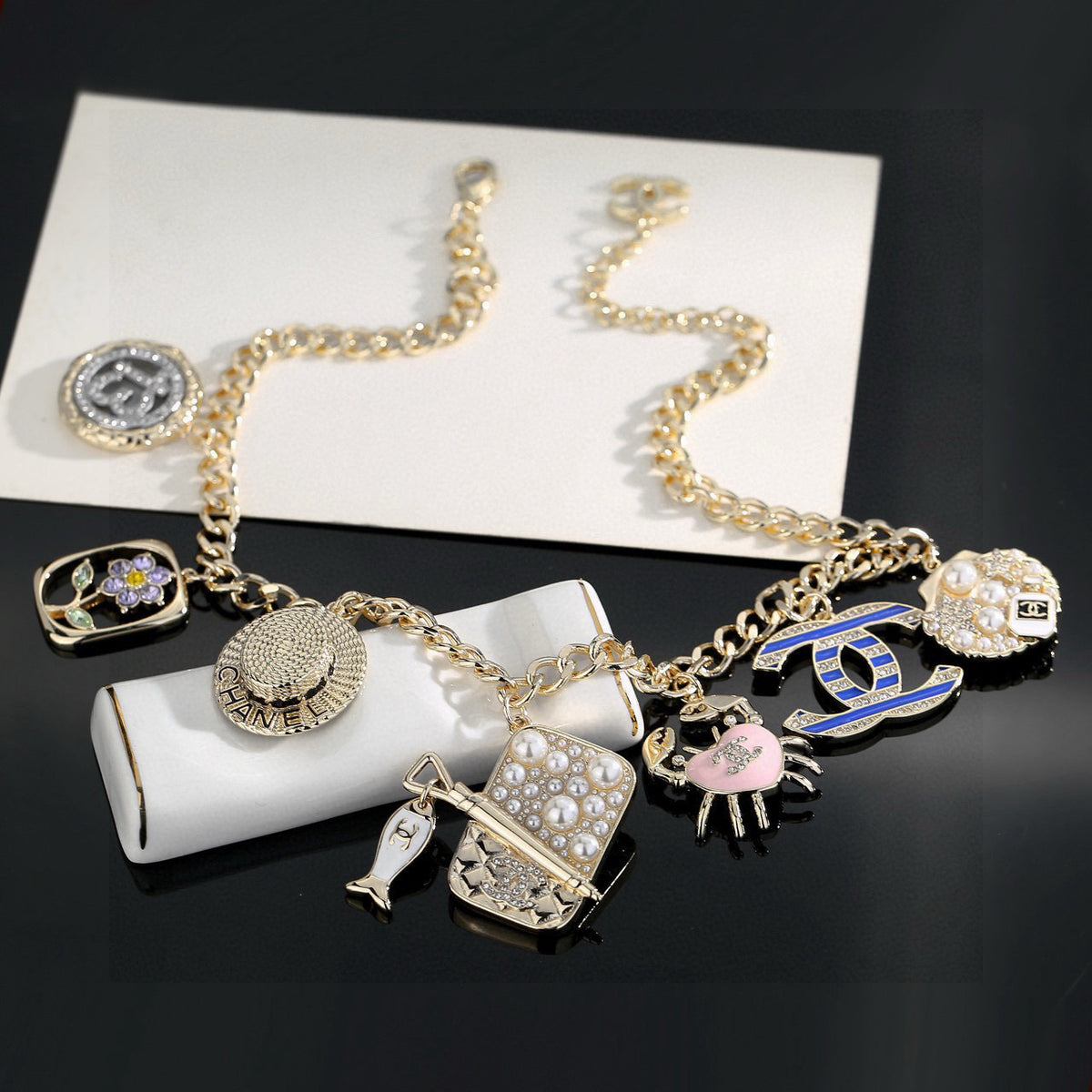 Double-C Emblem Pendant Necklace in Gold-Tone – Shell Detail styled product view