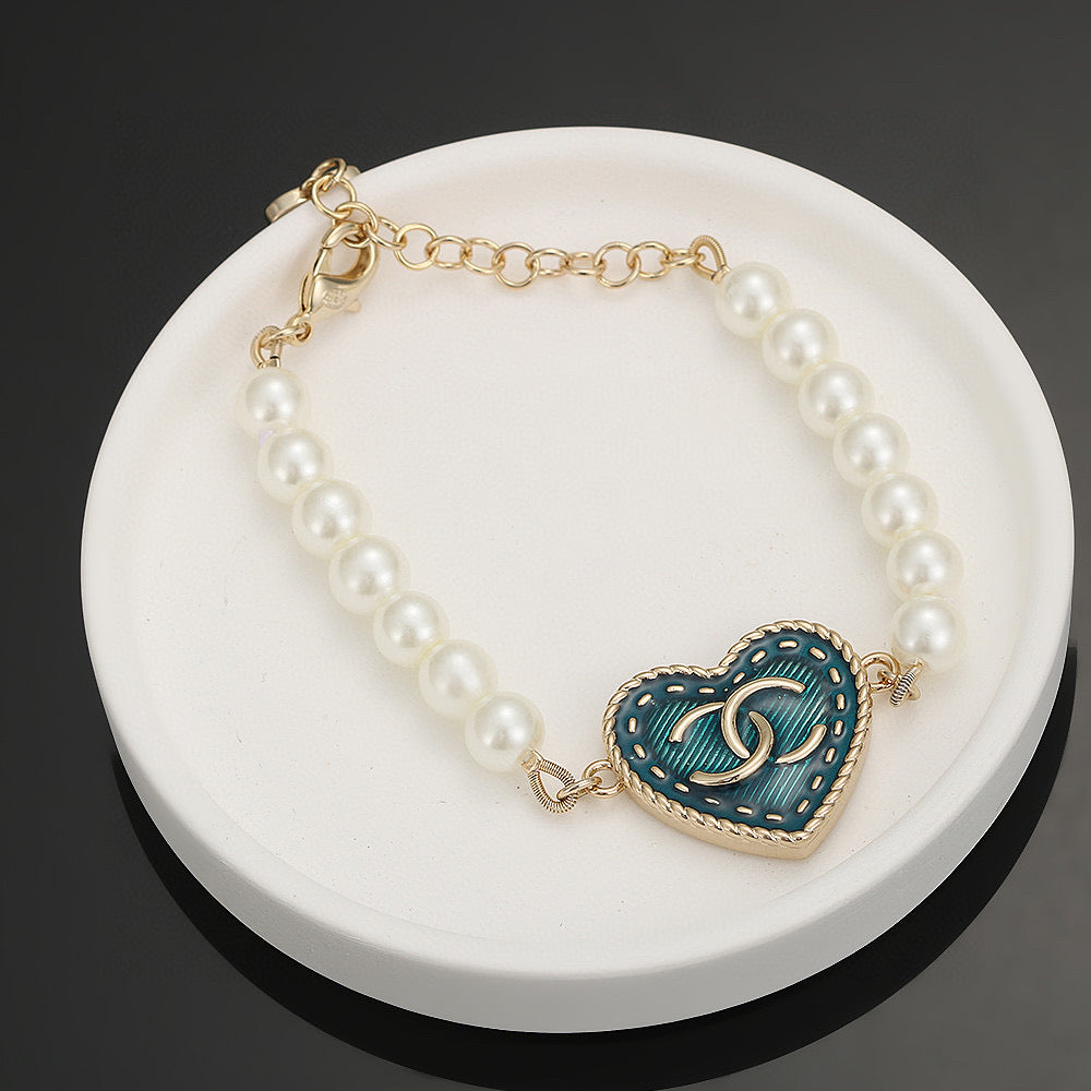 Double-C Emblem Bracelet in Polished Metal-Tone – Pearl Detail – Design 004 front product view