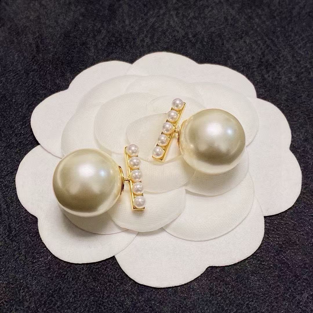Signature Emblem Pearl-Detail Stud Earrings – Pearl Detail styled detail